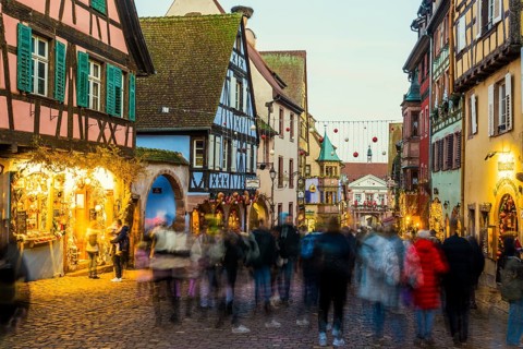Christmassy decorated half-timbered houses, Christmas market, Riquewihr, Grand Est, Haut-Rhin,