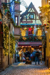 Christmassy decorated half-timbered houses, Christmas market, Riquewihr, Grand Est, Haut-Rhin,