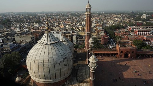 Jama Masjid mosque with minarets amidst a wide panoramic view of the city, Delhi, India