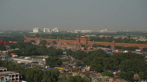 Overview of the Red Fort with surrounding trees and urban views, Delhi, India