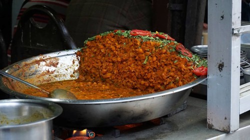 Large pan of Indian curry dish being cooked, Manali, Himachal Pradesh, India