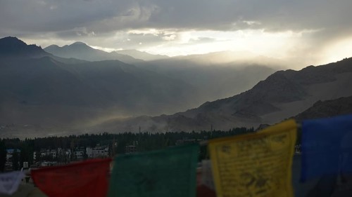 Prayer flags in foreground, mountains in sunset haze, Leh, Ladakh, North India, Himalayas, India