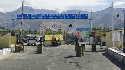 Entrance to Leh with a welcome sign and views of the surrounding mountains, Leh, Ladakh, North