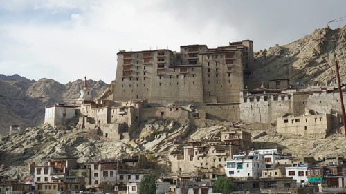 Historic fortress, Leh Palace on a rocky mountain in an urban setting, Leh, Ladakh, North India,