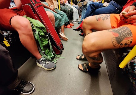 Show me your legs, show me your shoes, lots of people on an S-Bahn in Berlin, Germany