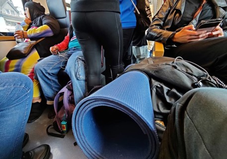 Many people crowded with their luggage on a very busy regional train, Germany