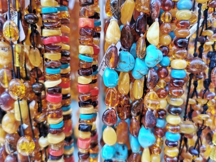Close-up of amber and colorful gemstones and pearls in various colors, Baltic Sea, Danzig, Poland