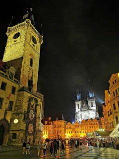 Night view, view of the historic Old Town Square with brightly lit buildings and towers and many