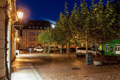 Atmospheric night view at a small market with a full moon, Meissen, Saxony, Germany