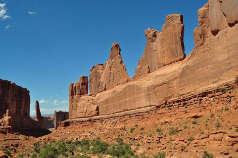 Majestic sandstone rocks, Wall Street, dominate the landscape under a clear sky, Arches National