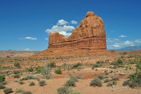 Large, eroded rock formation in a dry, open area of land, Arches National Park, Utah, USA
