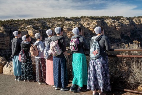 Grand Canyon National Park, Arizona. Young Mennonite women from Wisconsin, wearing traditional