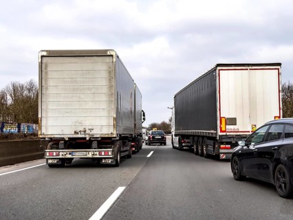 Driving on the A57 motorway, at the Kamp-Lintfort interchange, 3 lanes, traffic jam due to