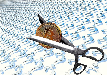Symbolic image, scissors divide Bitcoin into question marks, stock prices, uncertain digital