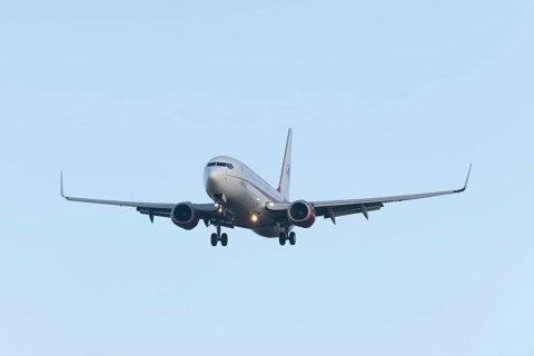 Boeing 737 commercial passenger airliner jet aircraft in flight on approach to land at London