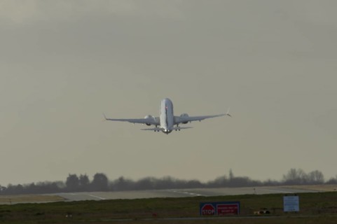 Boeing 737 commercial passenger airliner jet aircraft taking off in flight at London Stansted