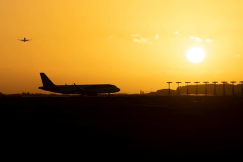 Airbus commercial passenger airliner jet aircraft taking off in flight with another plane on the