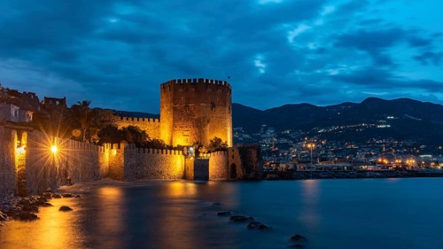 Alanya, Turkey, April 9th 2021 Stunning panorama of Alanya Harbour and the Red Tower at night with