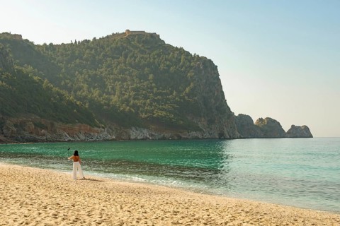 Alanya, Turkey. April 7th 2021 Beautiful woman taking a selfie on a bright sunny Kleopatra beach in