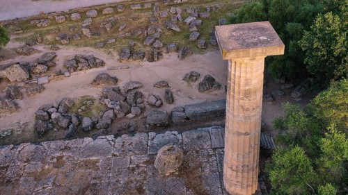 Column of the Temple of Zeus in morning light, close-up of a stone column on a ruined site
