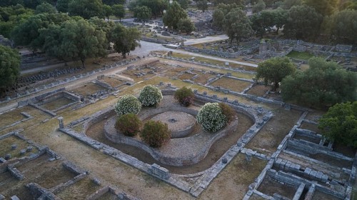 Leonidaion, complex with ruins and symmetrical stone structures surrounded by green vegetation,