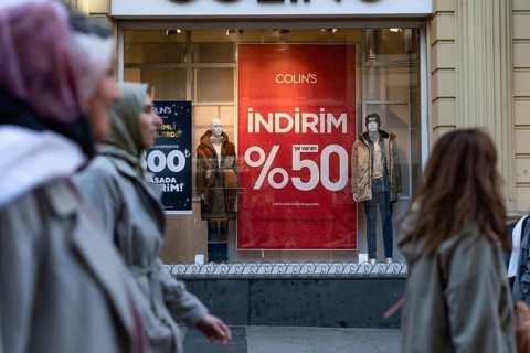 Istanbul, Turkey 7th January 2025. 50% Sale prices displayed in shop window in a busy shopping