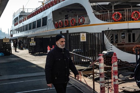 Istanbul, Turkey. January 3rd 2025. A Turkish man disembarks a ferry docked at Karakoy ferry port