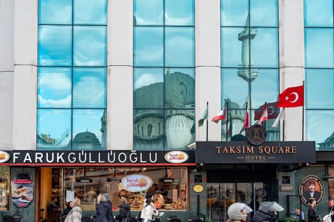 Istanbul, Turkey. January 3rd 2025. Farukgulluoglu Sweet shop and the Taksim Square Hotel at the
