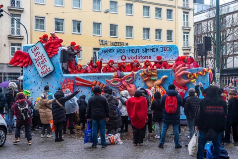 Rose Monday procession in Düsseldorf, theme car from companies, here wholesale company Vodafone, at