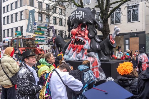 Rose Monday procession in Düsseldorf, theme car by wagon manufacturer Jacques Tilly, topic of mass