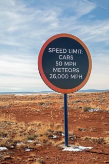 Winslow, Arizona - A speed limit sign on the road to Meteor Crater. The crater was formed about 50,