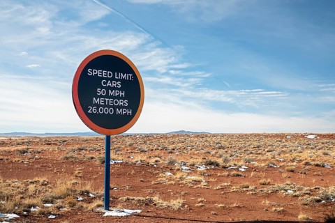Winslow, Arizona - A speed limit sign on the road to Meteor Crater. The crater was formed about 50,