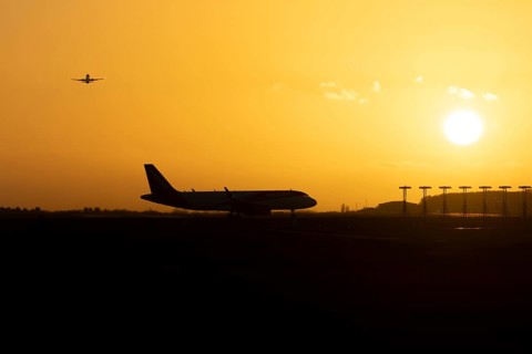 Airbus commercial passenger airliner jet aircraft taking off in flight with another plane on the