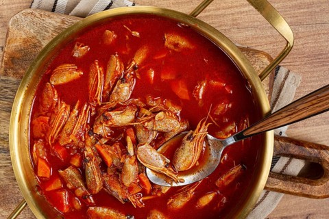French shrimp bisque soup, in a pot, close-up, no people