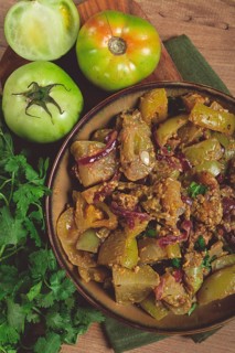 Fried green tomatoes, with onions and spices, green tomato appetizer, Georgian cuisine, homemade,