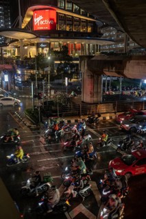 Bangkok, Thailand. March 26th 2025. A busy traffic interchange with lots of motorcycles during wet