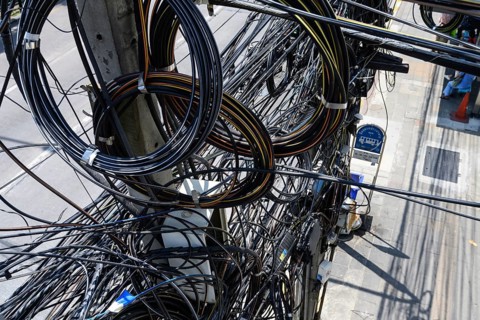 Bangkok, Thailand. March 4th 2025. A tangled mess of cables and wires used for phone and internet