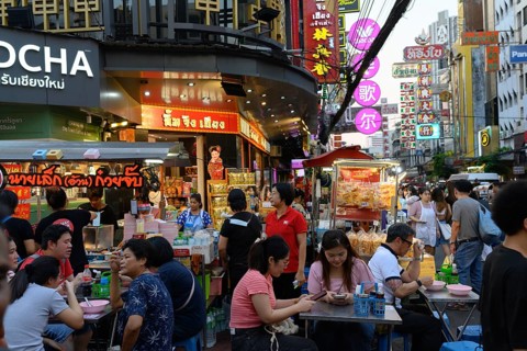 Bangkok, Thailand. February 18th 2025. Busy evening crowds at popular street food stalls along