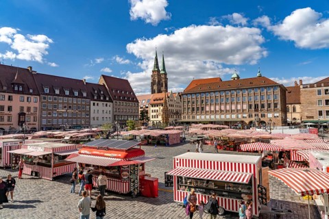 Market stalls on the main market and St. Sebaldus Church in Nuremberg, Bavaria, Germany