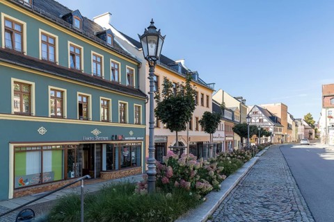 On the Altmarkt, in the background the historic postal goods, Hohenstein-Ernstthal, Saxony, Germany
