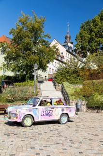 Colourfully painted and planted Trabant car on the old market in Hohenstein-Ernstthal, Saxony,