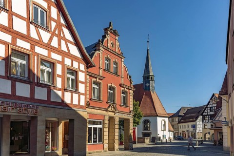 Half-timbered house and the Roman Catholic hospital church of St. Katharina in Forchheim, Upper