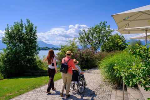 Walkers with wheelchair, Gstadt am Chiemsee, Chiemgau, Upper Bavaria, Bavaria, Germany