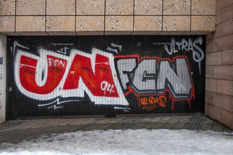 Illegal graffiti of the Nuremberger 1st FCN of the Ultras at an emergency exit, Nuremberg, Middle