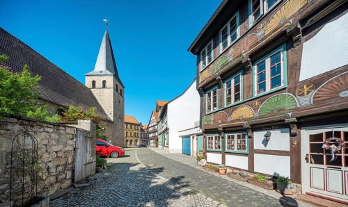 Alley with half-timbered houses and cobblestones at St. Nikolai church, half-timbered town of