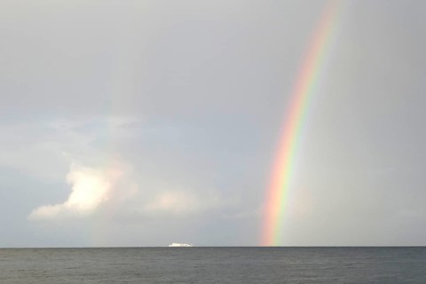 Unity Line ferry, rainbow, Rügen island, largest and most populous German island. Baltic Sea coast,