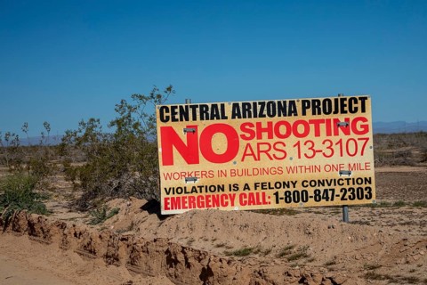 Buckeye, Arizona - A sign near the Central Arizona Project canal prohibits shooting because of