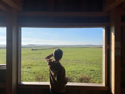 Boy watching cranes with binoculars, Perfect place to watch cranes, Nabu, Crane panorama at Günzer