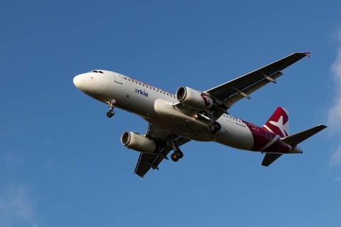 Airbus A320 commercial passenger airliner jet aircraft of Electra airlines flying on approach to