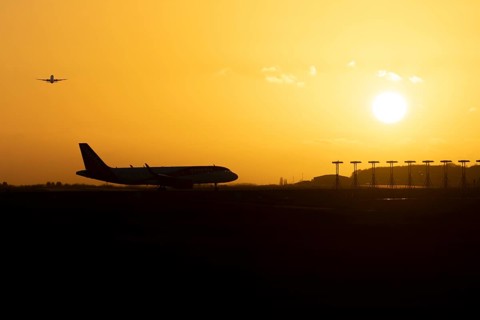 Airbus commercial passenger airliner jet aircraft taking off in flight with another plane on the